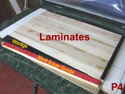 Sled for vacuum pressing laminates with wedge to apply side pressure.