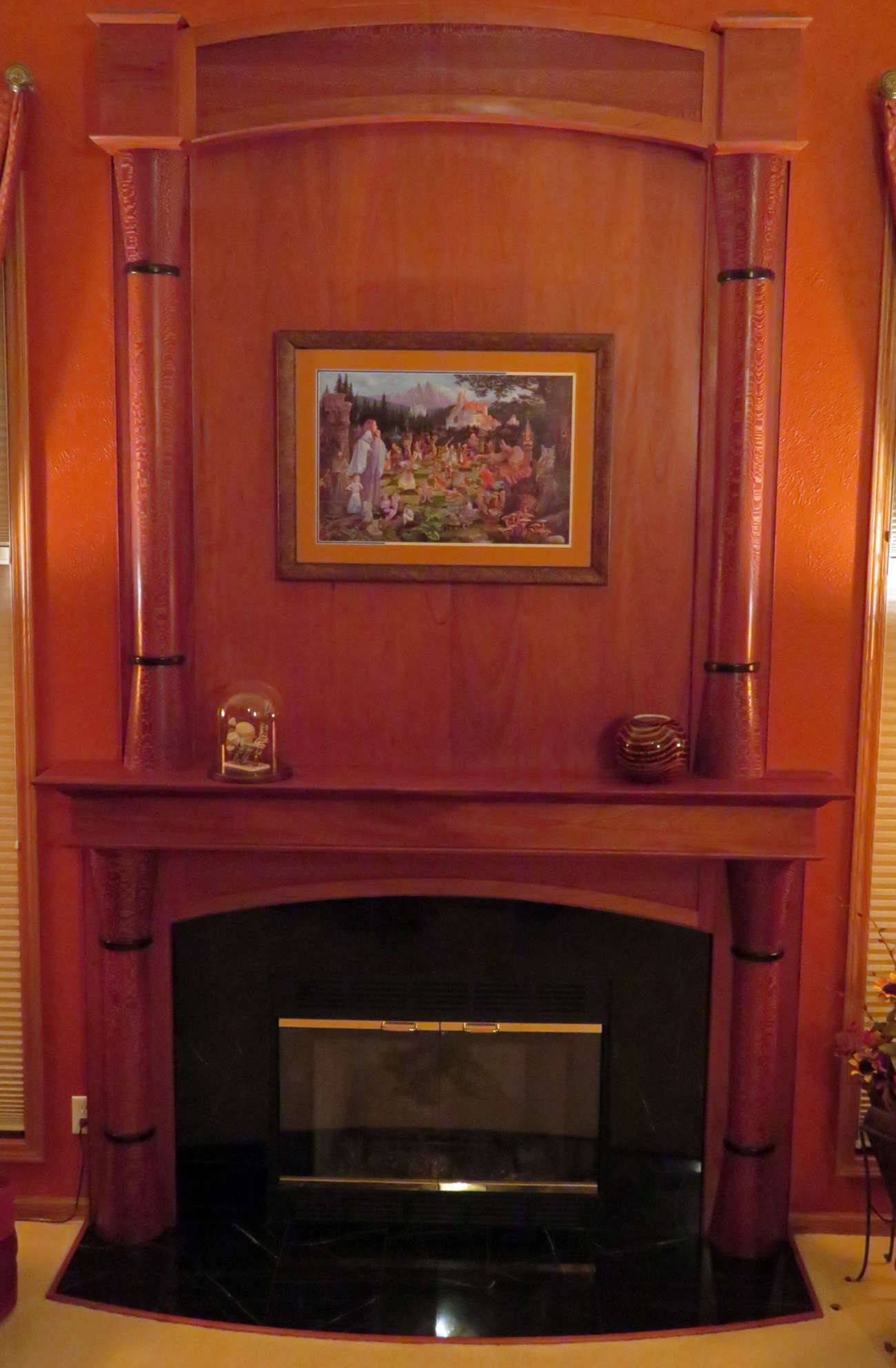 custom mantel designed with customer.  Woods used are:Honduras Mahogany,, Leopard Wand and Wenge.  This highlights the entire room.