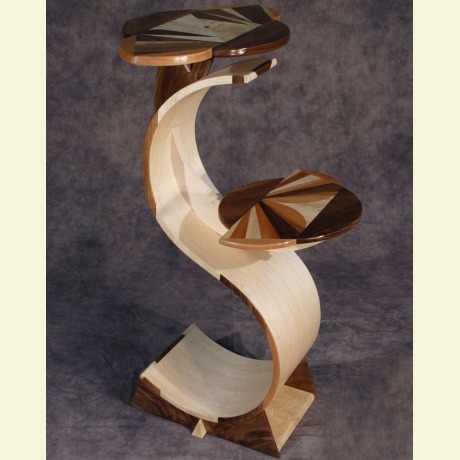 Bent laminated and veneered table stand. Bent laminating and veneering done in a vacuum press
