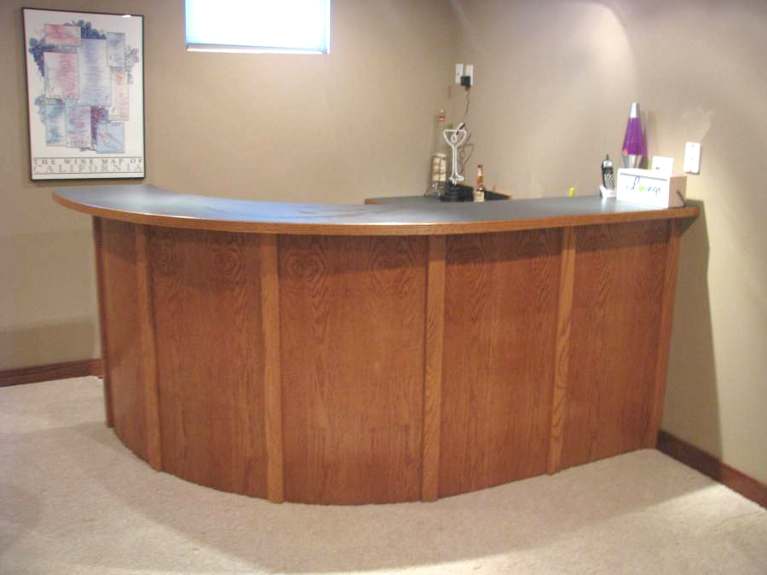Curved veneered bar without chairs Lincoln East hight School